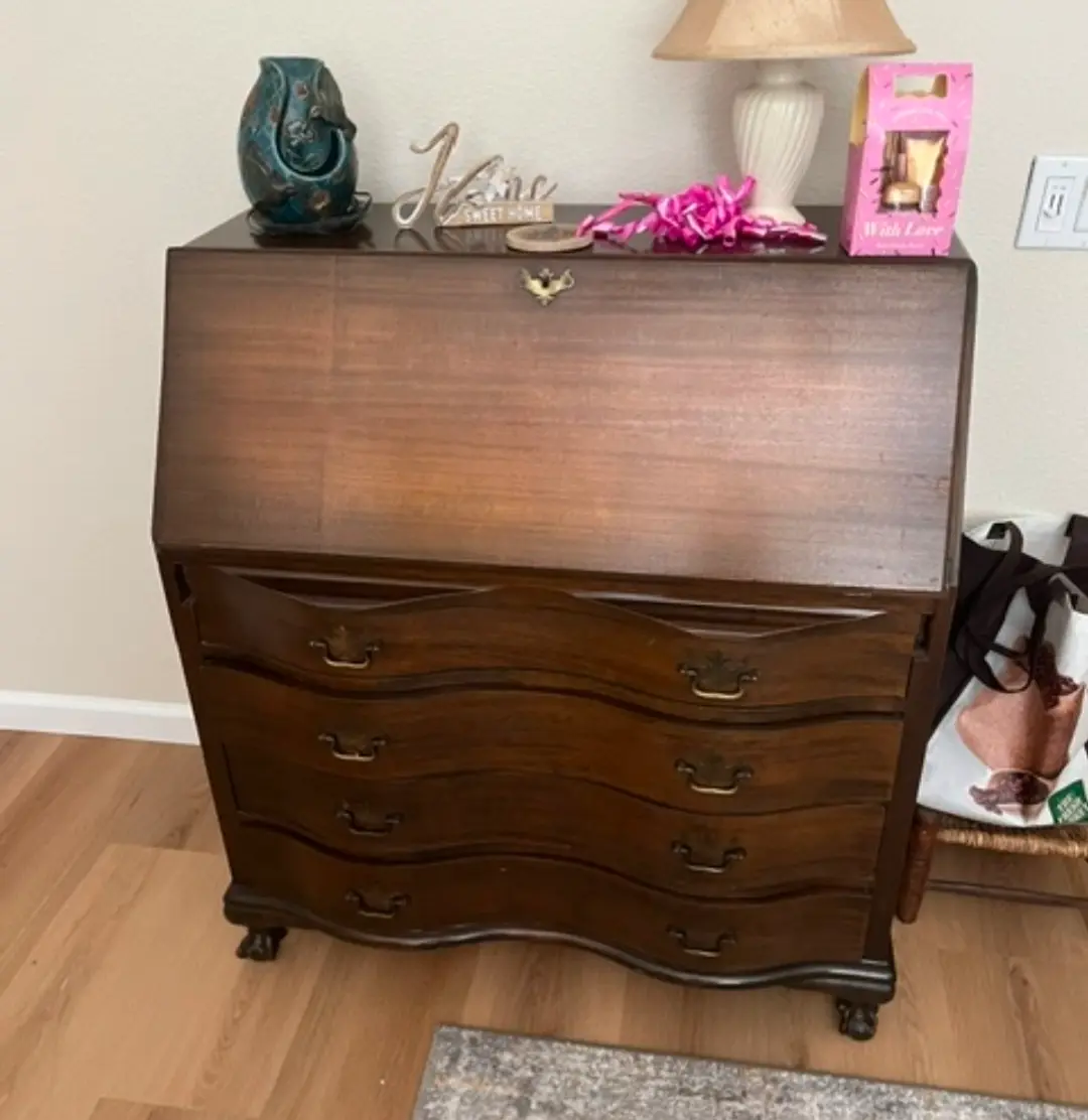 Hundred-year-old slant front secretary desk before restoration, its original finish dulled and worn