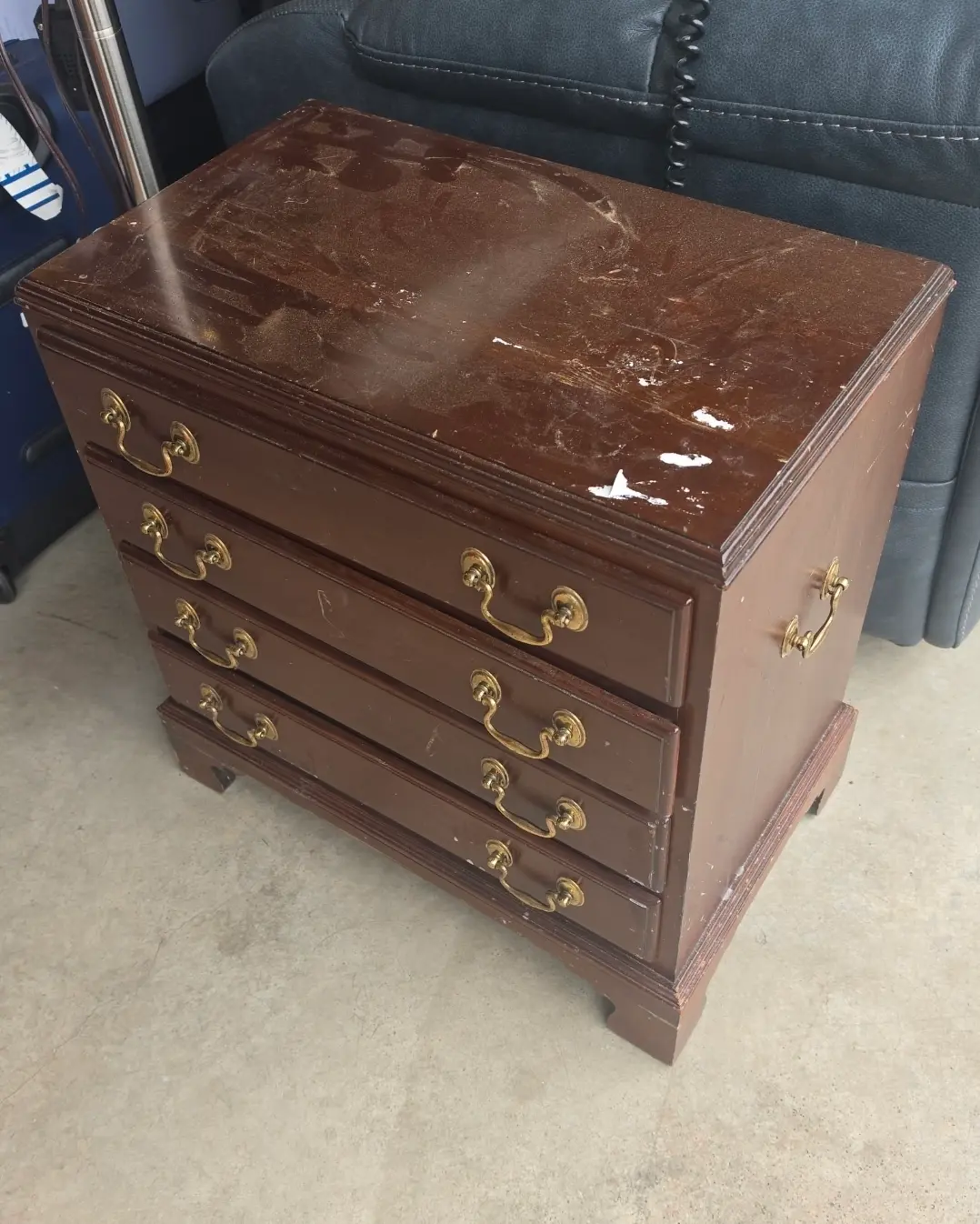 Ethan Allen mahogany nightstand before restoration, scratched and paint marked across the top